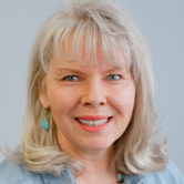 A headshot of Pam Jumonville